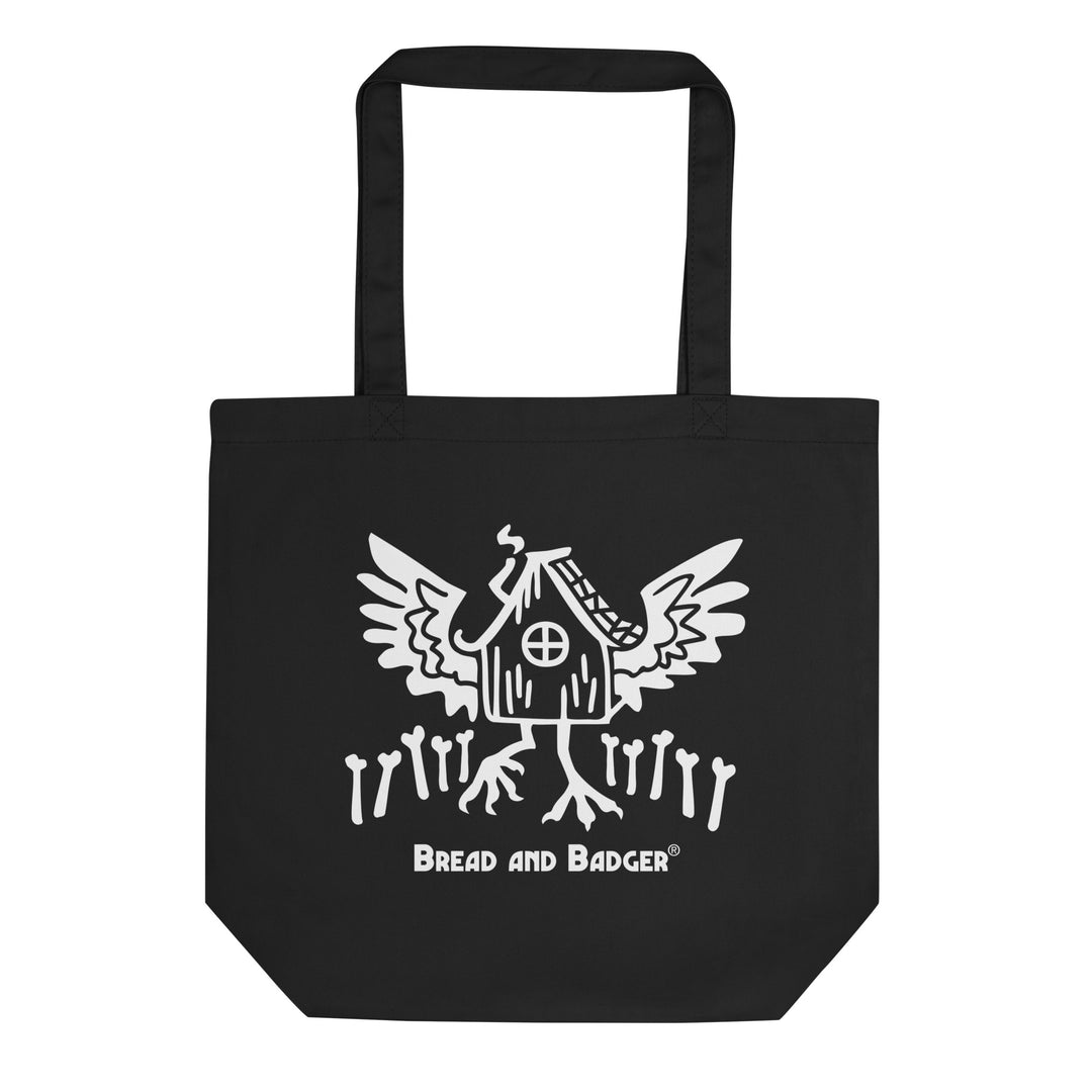 Black tote bag with white Baba Yaga's hut graphic and 'Bread and Badger' text on a white background