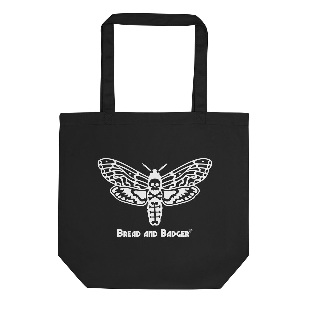 Black tote bag with white moth design and 'Bread and Badger' logo on a white background