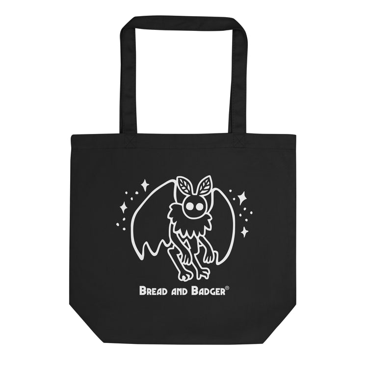 Black tote bag with a white mothman  graphic and 'Bread and Badger' text on a white background