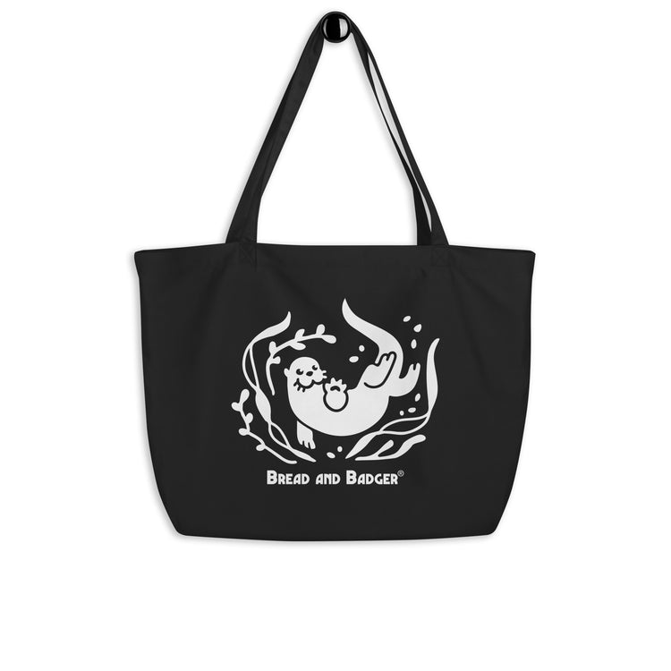 Black tote bag with a white otter and 'Bread and Badger' text on a white background