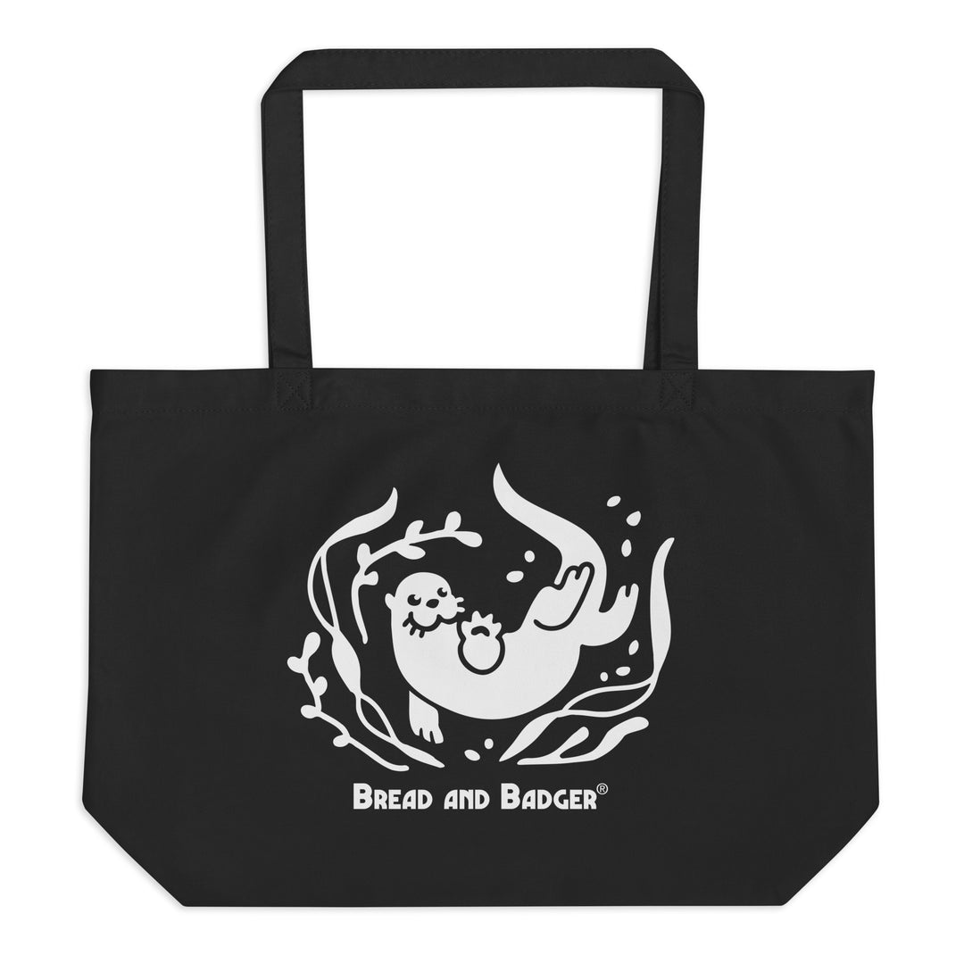 Black tote bag with a white otter and 'Bread and Badger' text on a white background