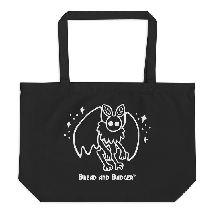 Black tote bag with a white mothman  graphic and 'Bread and Badger' text on a white background