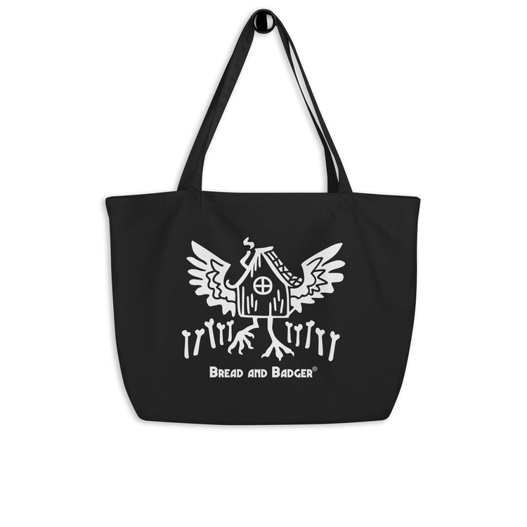 Black tote bag with white Baba Yaga's hut graphic and text on a white background