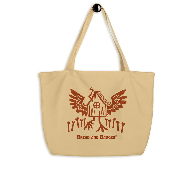 Beige tote bag with red Baba Yaga's hut graphic and 'Bread and Badger' text on a white background