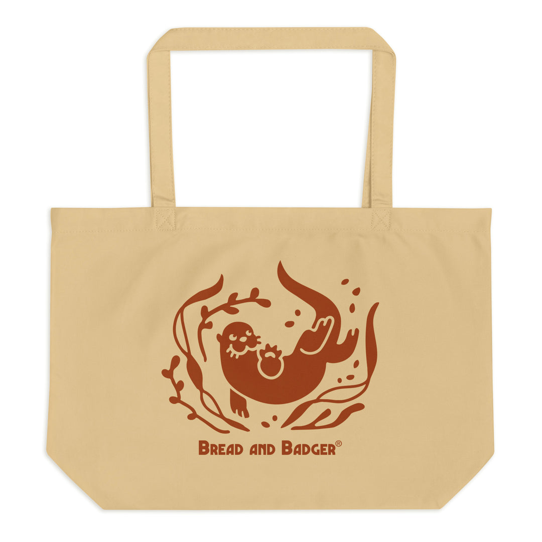 Beige tote bag with brown otter and 'Bread and Badger' text on a white background