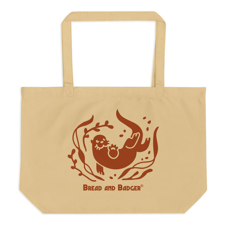 Beige tote bag with brown otter and 'Bread and Badger' text on a white background
