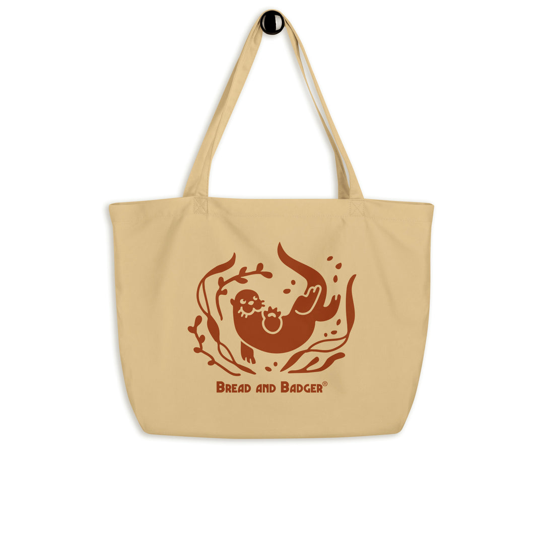 Beige tote bag with brown otter and 'Bread and Badger' text on a white background