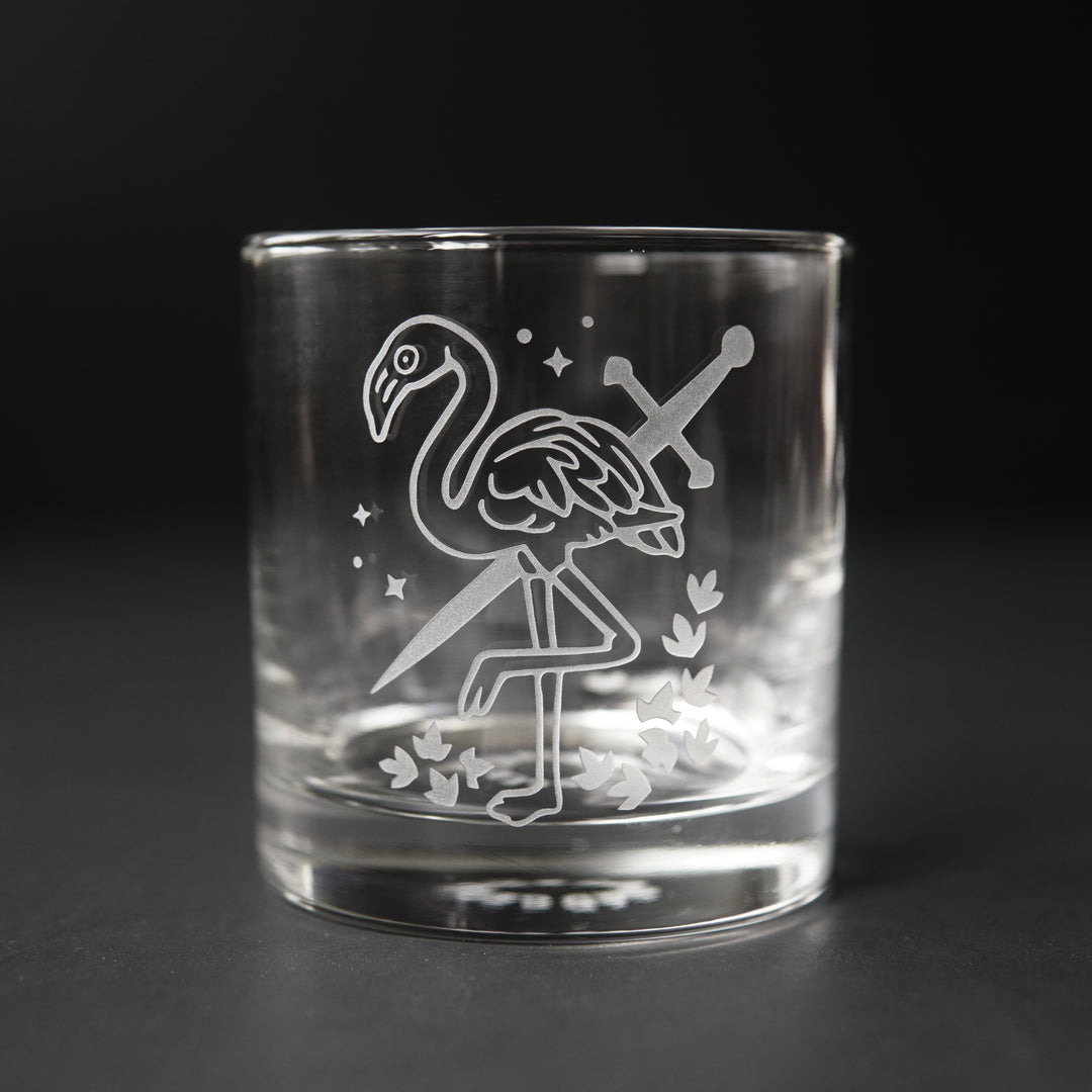 lowball glass etched with a flamingo and sword