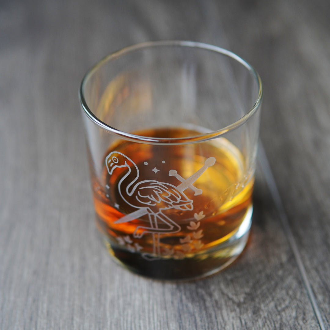 flamingo and sword etched lowball glass with whiskey