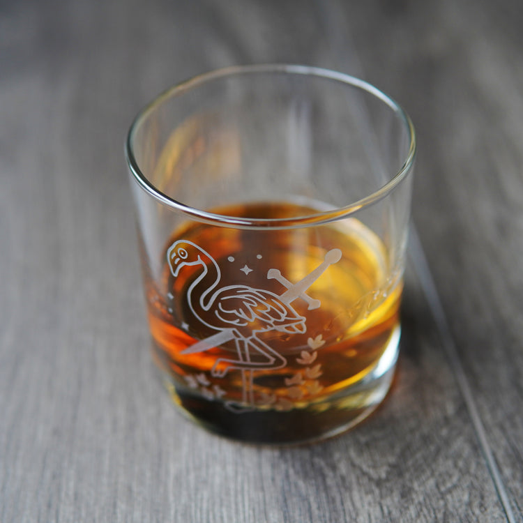 flamingo and sword etched lowball glass with whiskey
