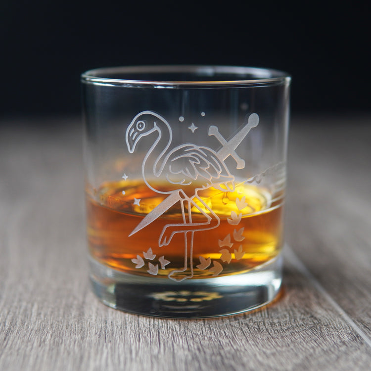 flamingo and sword etched lowball glass with whiskey