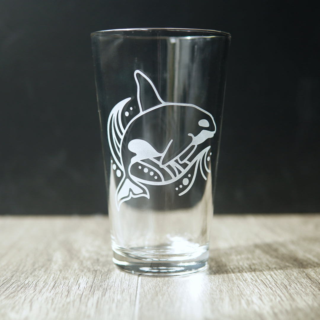 Orca whale and a wave engraved on a pint glass