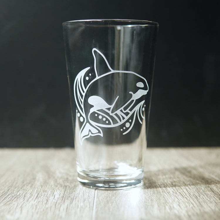 Orca whale and a wave engraved on a pint glass