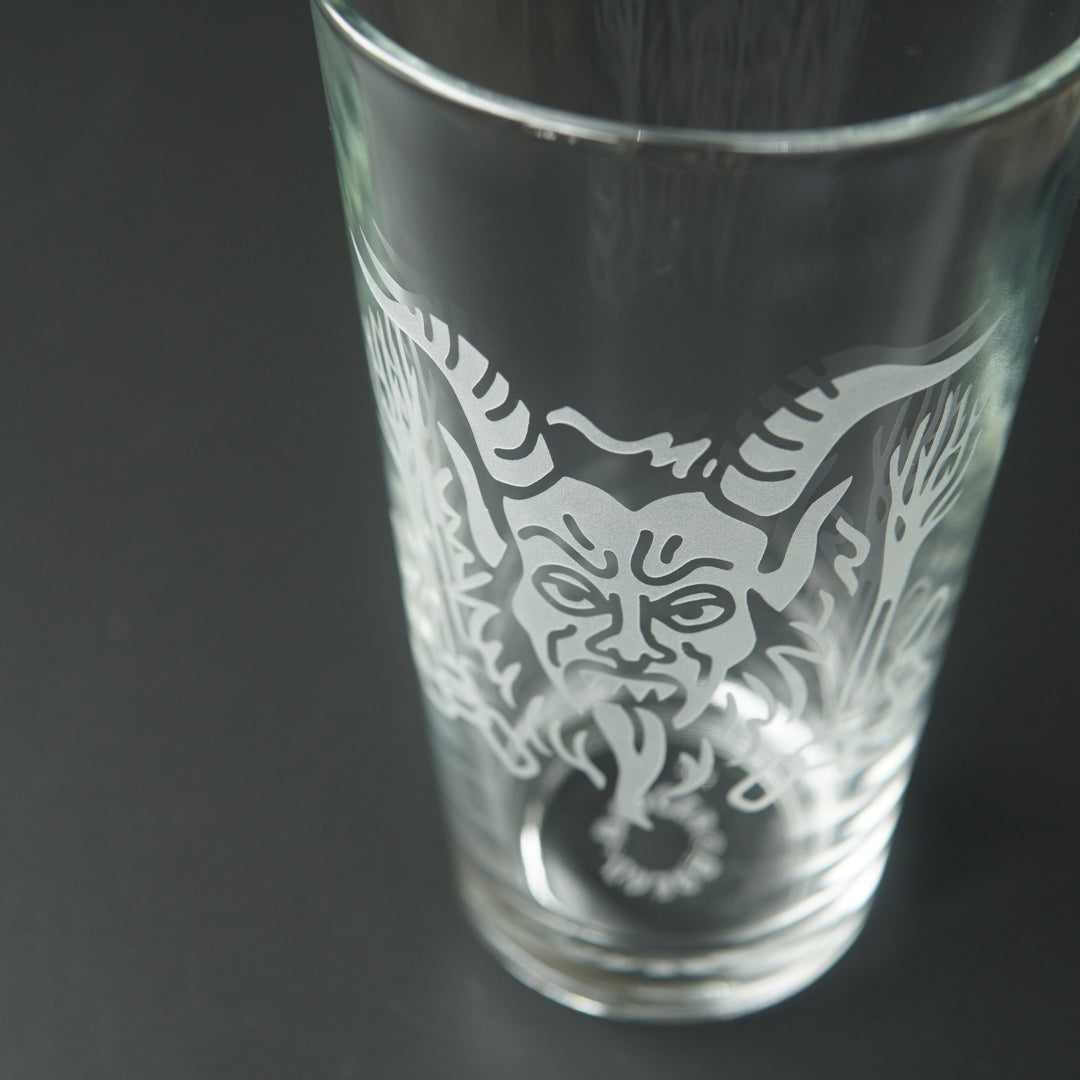 Pint glass engraved with Krampus' head