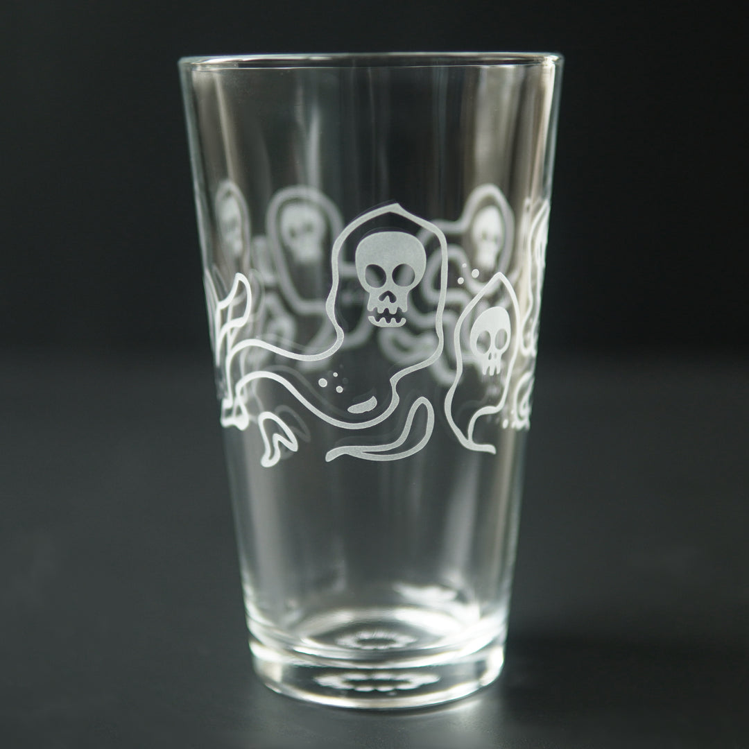 pint glass etched with ghosts with skull faces