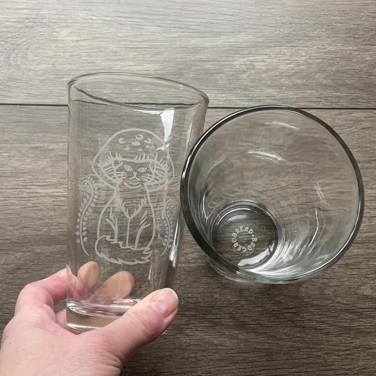 video of two mushroom cat pint glasses