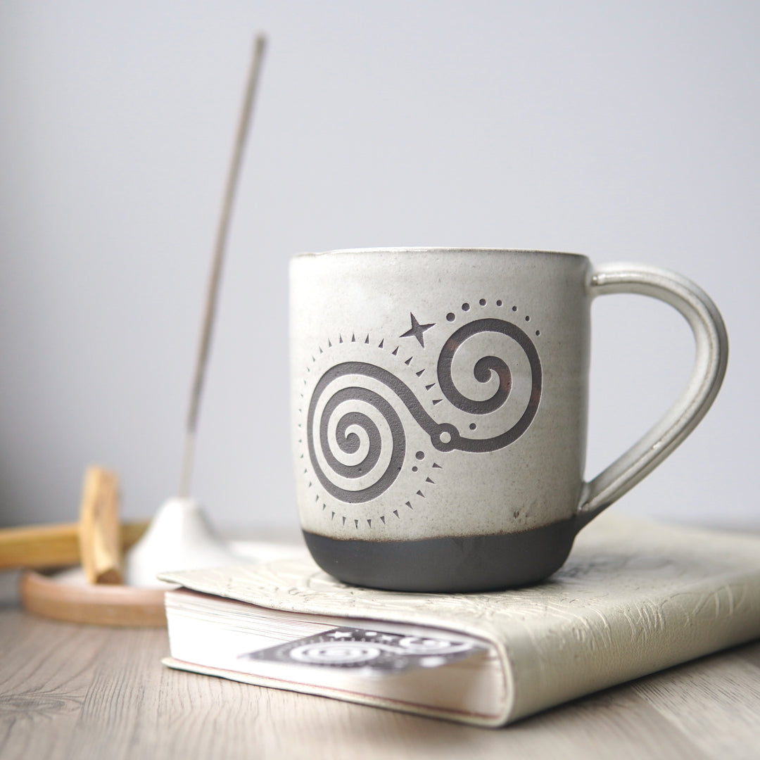 Deep Breath Mug for meditation breathing exercises in white over chocolate clay