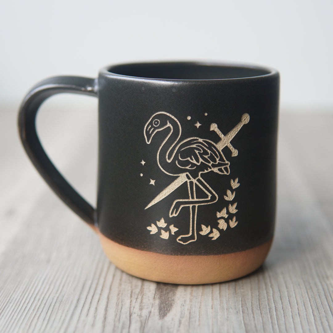 black flamingo with a sword mug