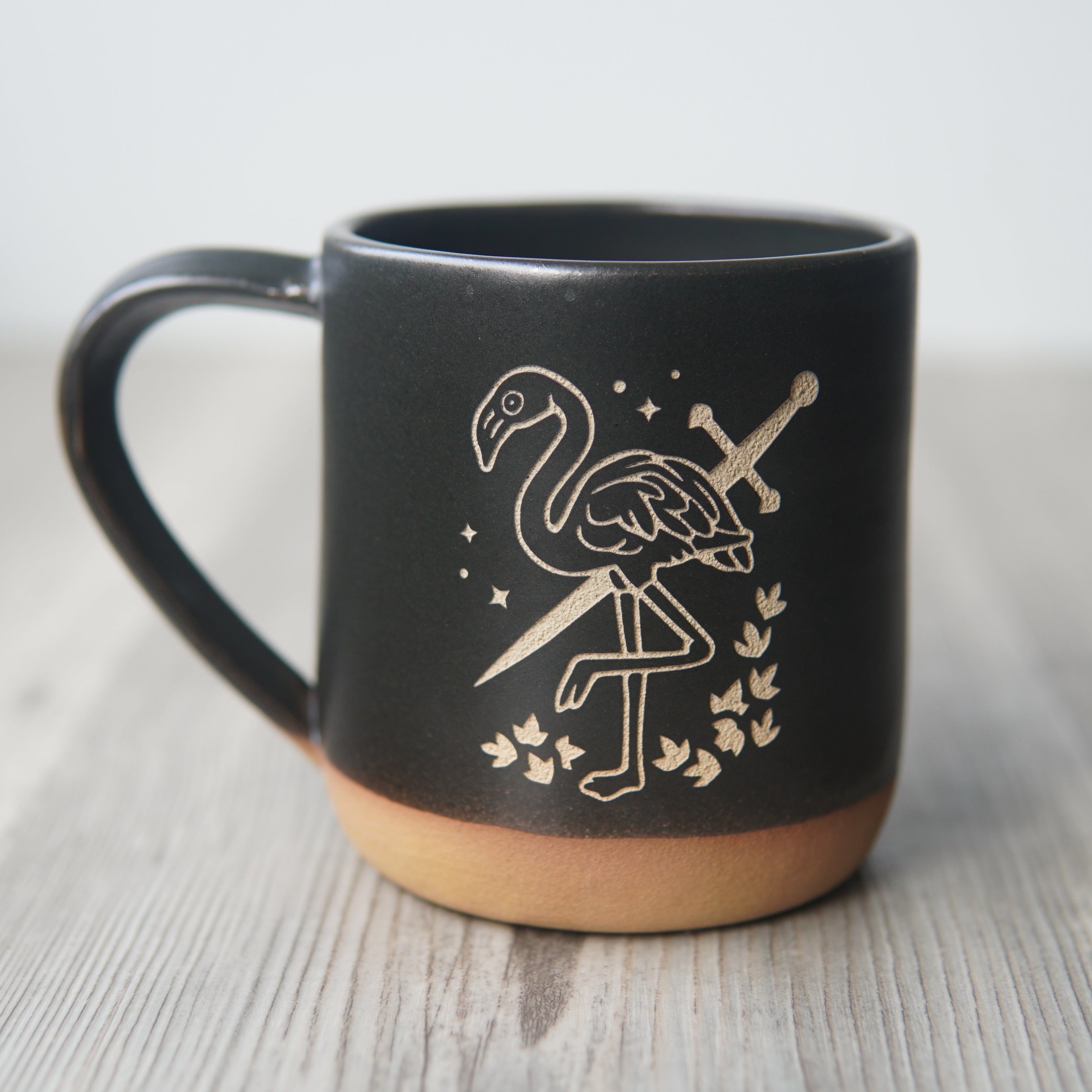 black flamingo with a sword mug