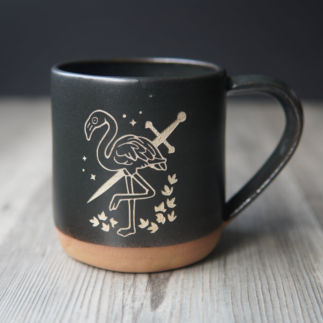 black flamingo with a sword mug