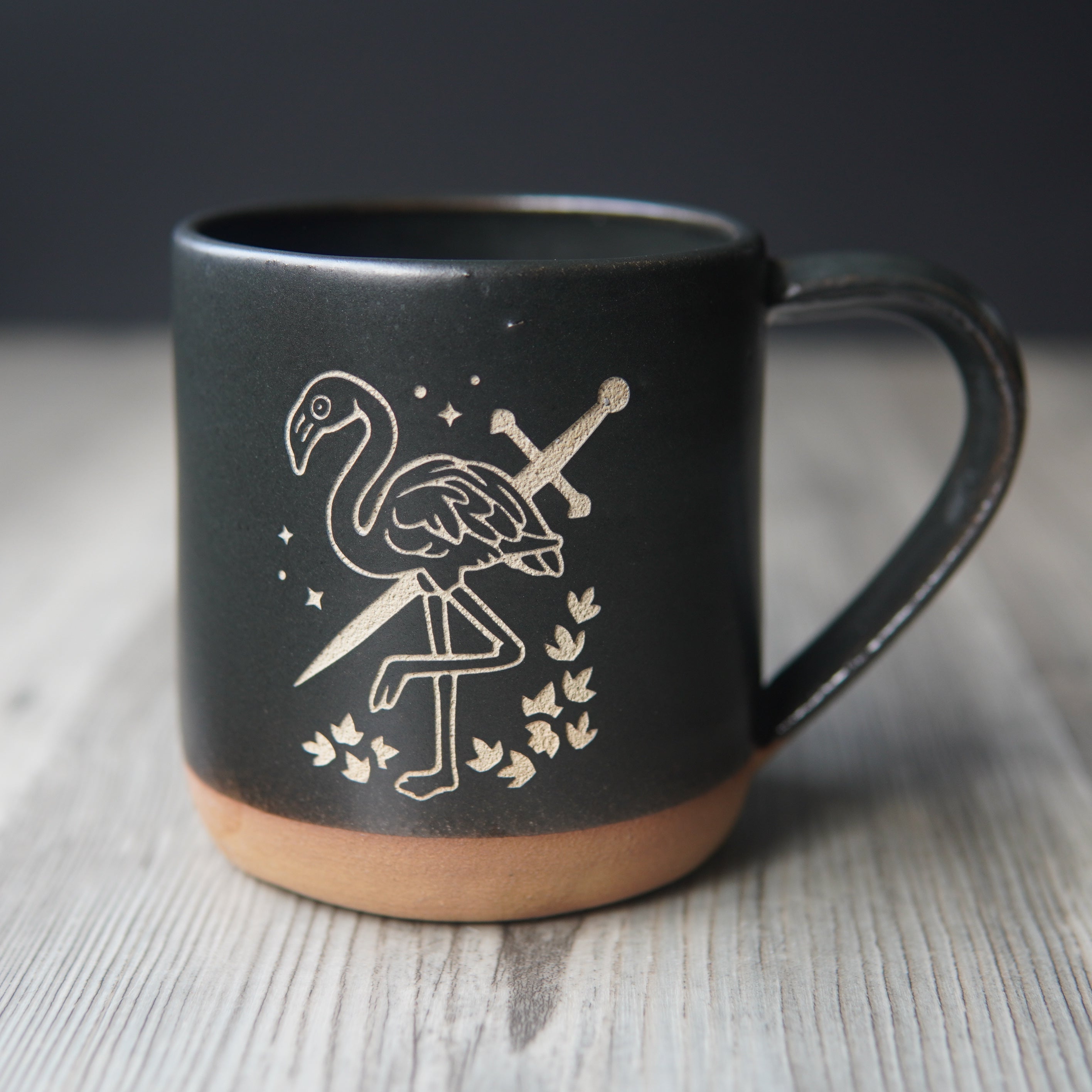 black flamingo with a sword mug