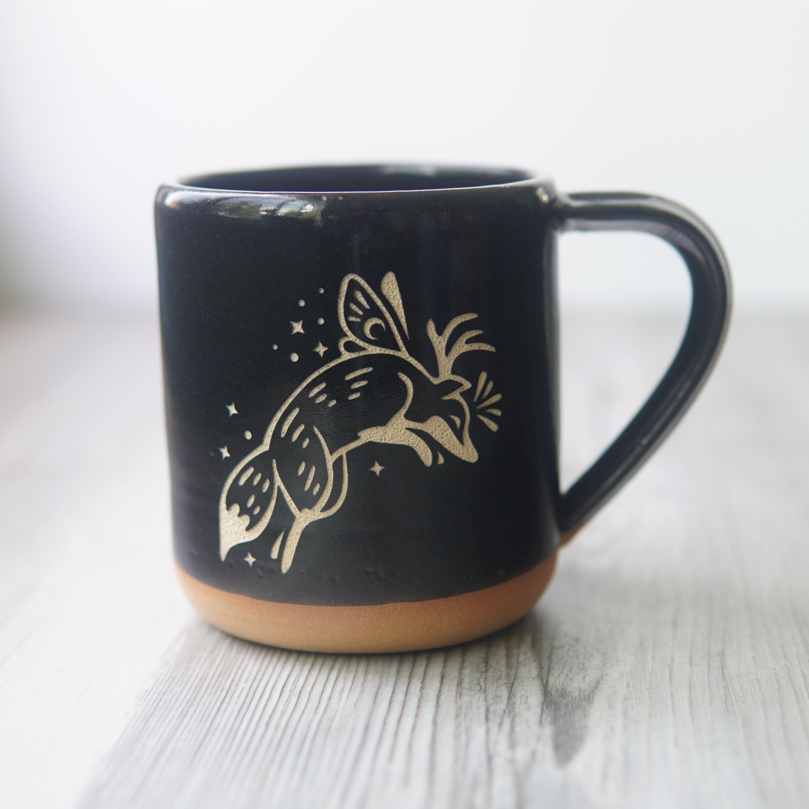 Fox Fairy engraved pottery mug in black glaze