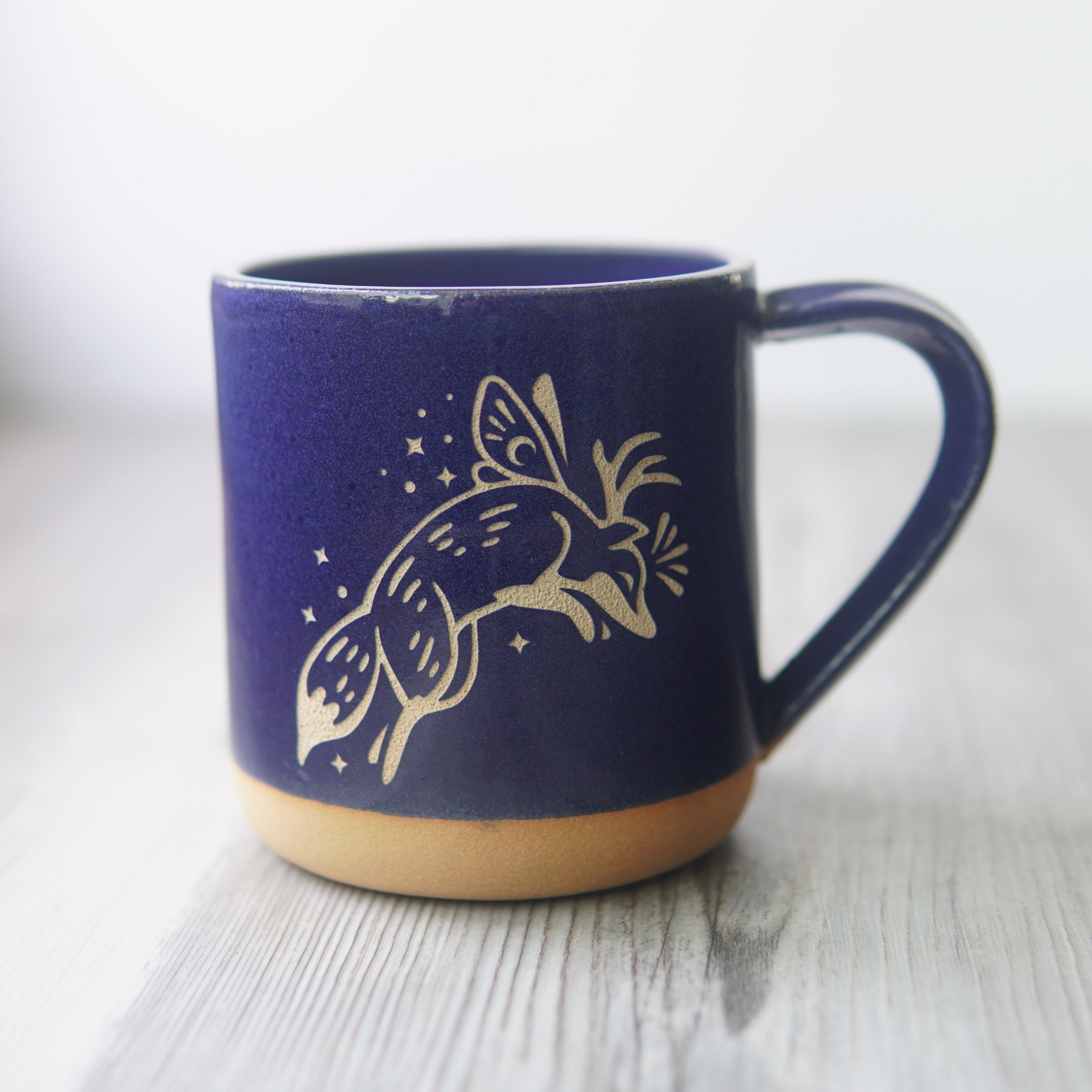 Fox Fairy engraved pottery mug in cobalt blue glaze