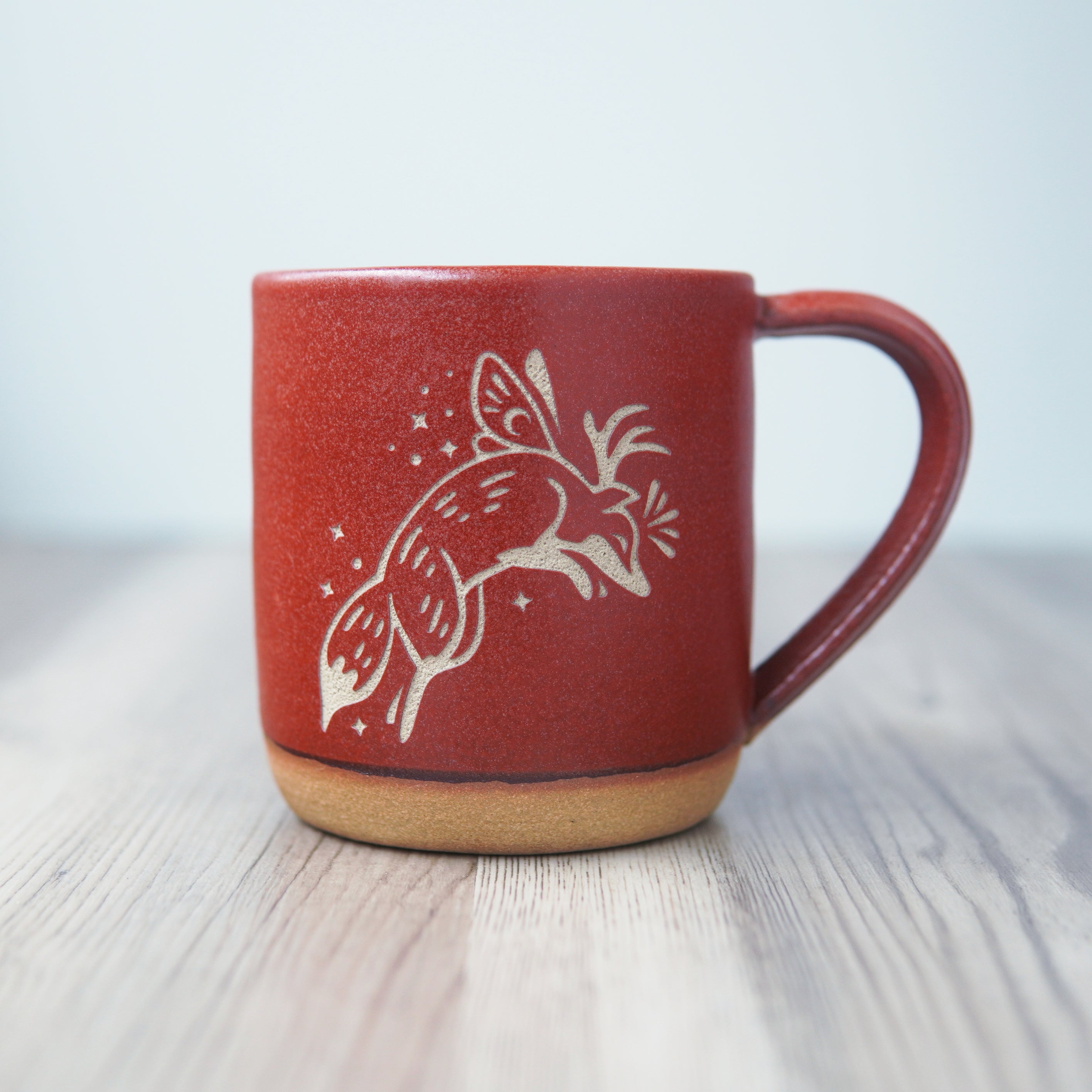 Fox Fairy engraved pottery mug in paprika red glaze