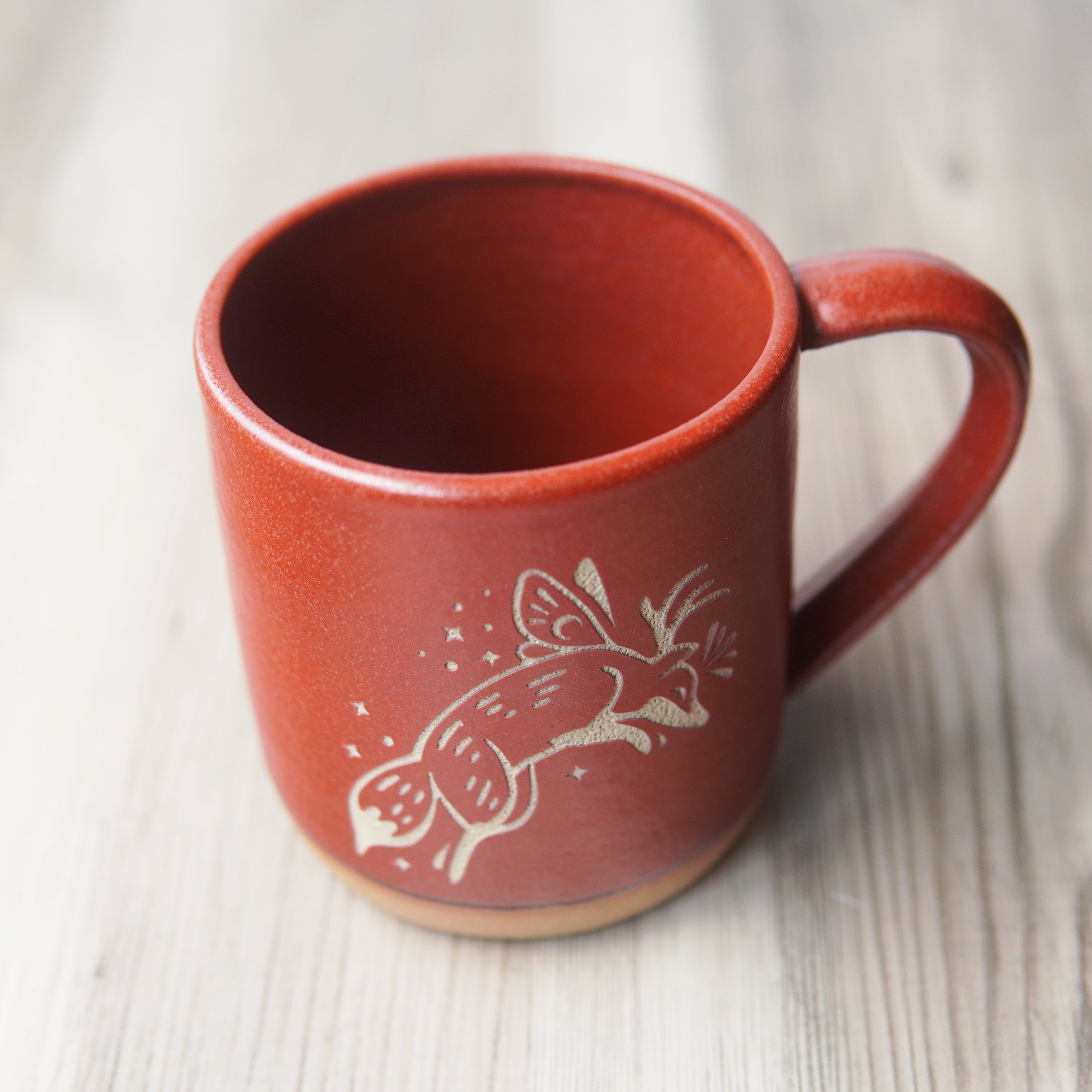 Fox Fairy engraved pottery mug in paprika red glaze