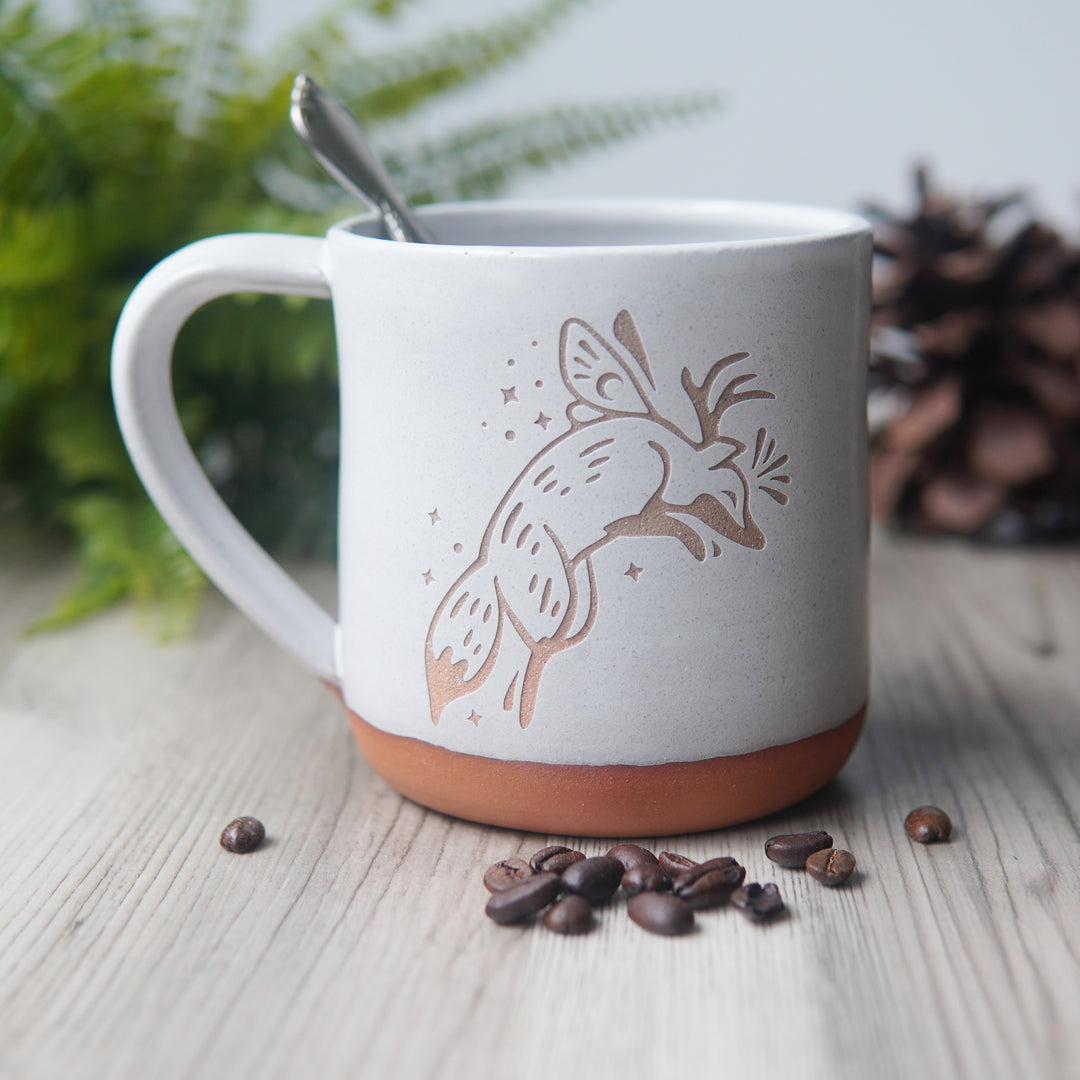 Fox Fairy engraved pottery mug in white glaze