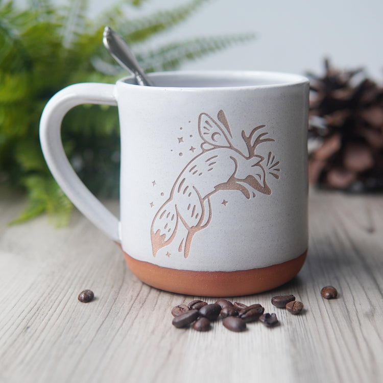 Fox Fairy engraved pottery mug in white glaze