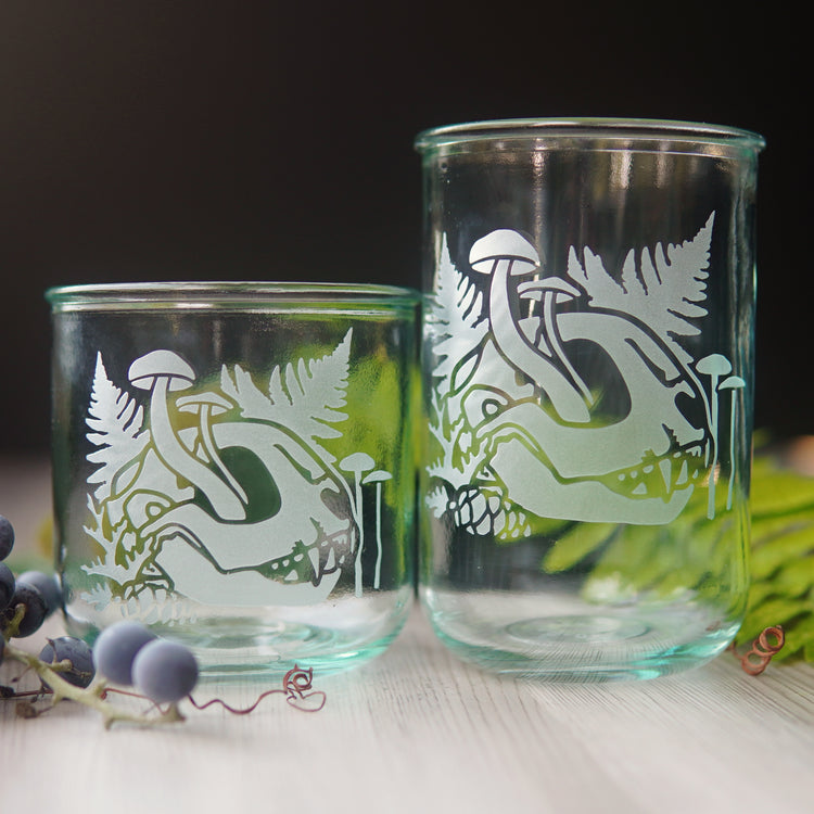 decaying cat skull engraved onto a short and tall recycled glass tumbler