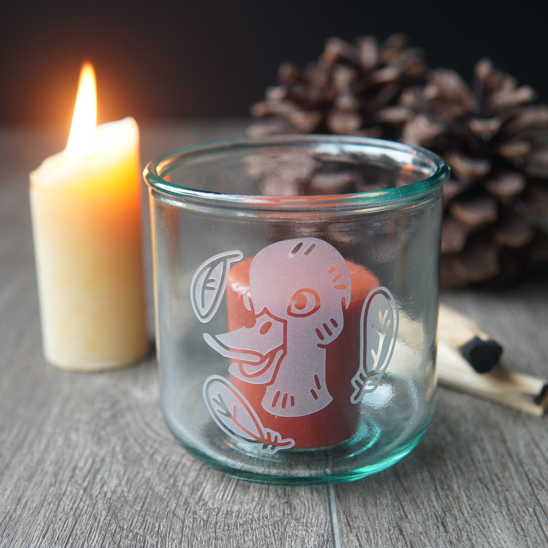 Duck etched short glass with a votive candle in it