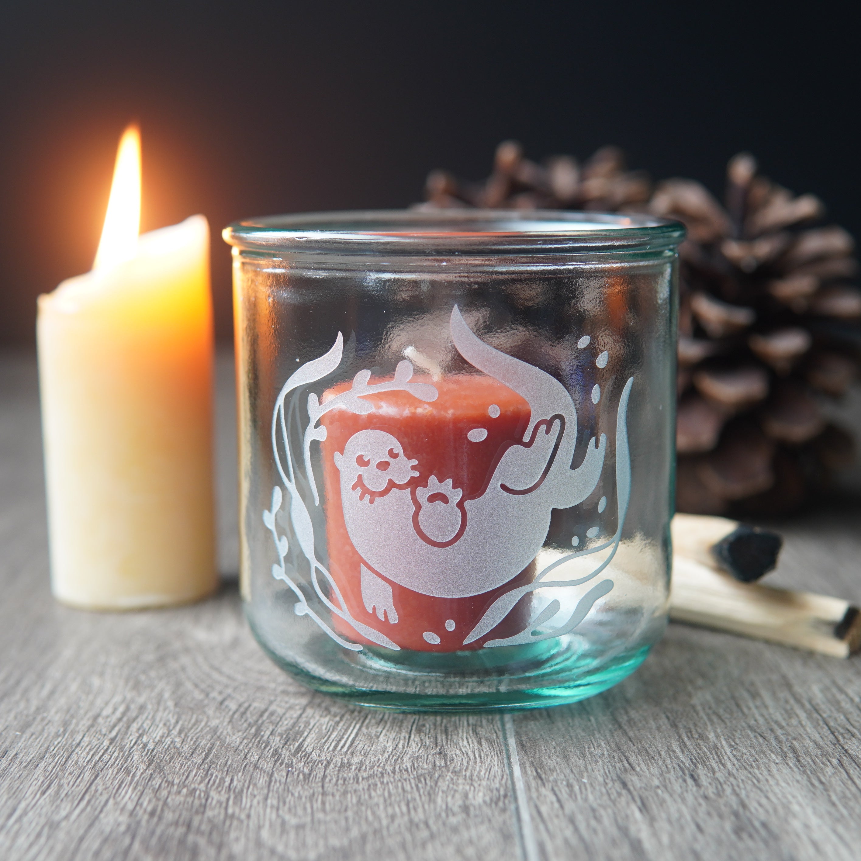 short otter glass with candles