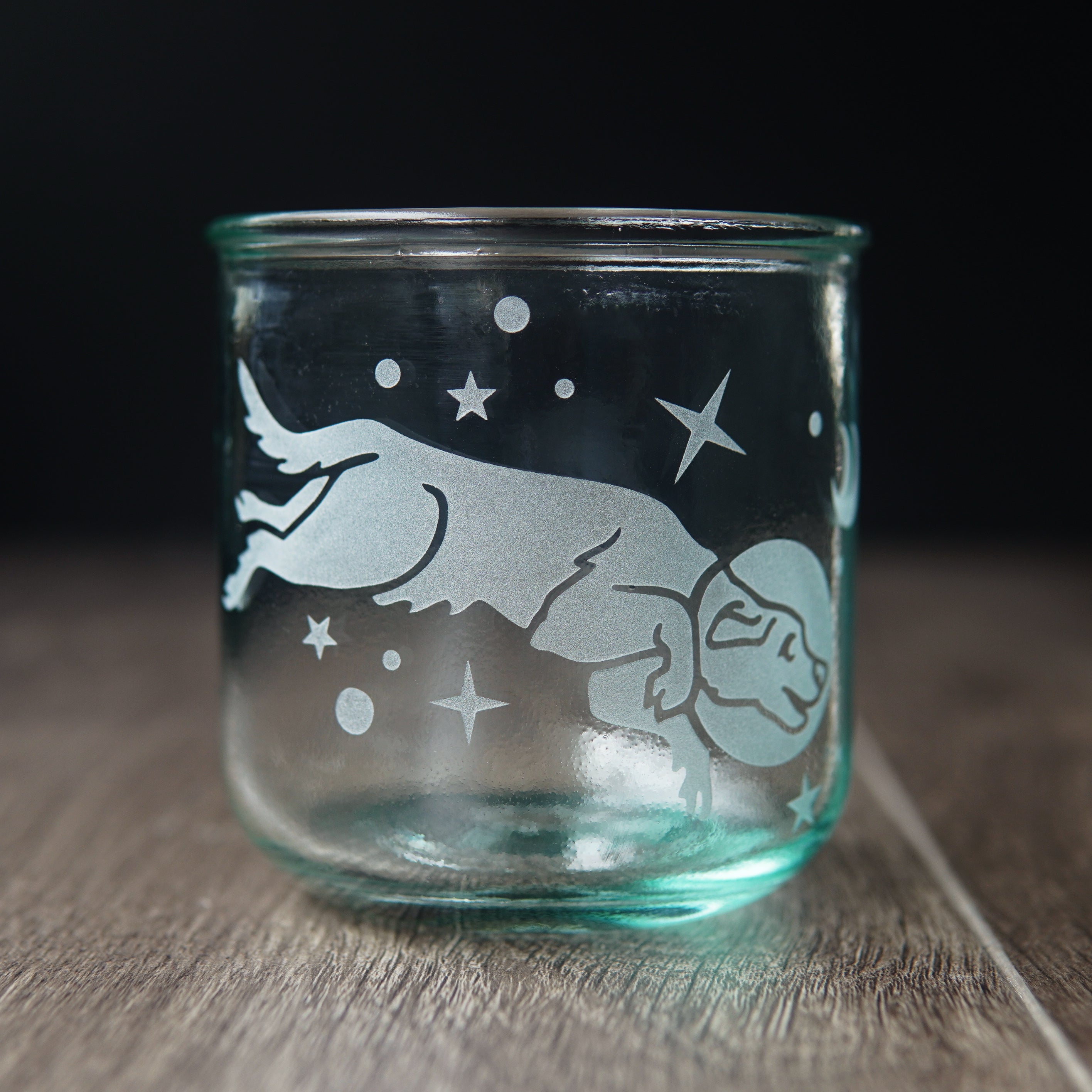 Space dog engraved onto short recycled drinking glass