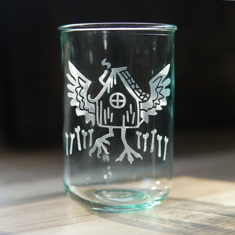 Baba Yaga's Hut etched onto a tall recycled glass cup