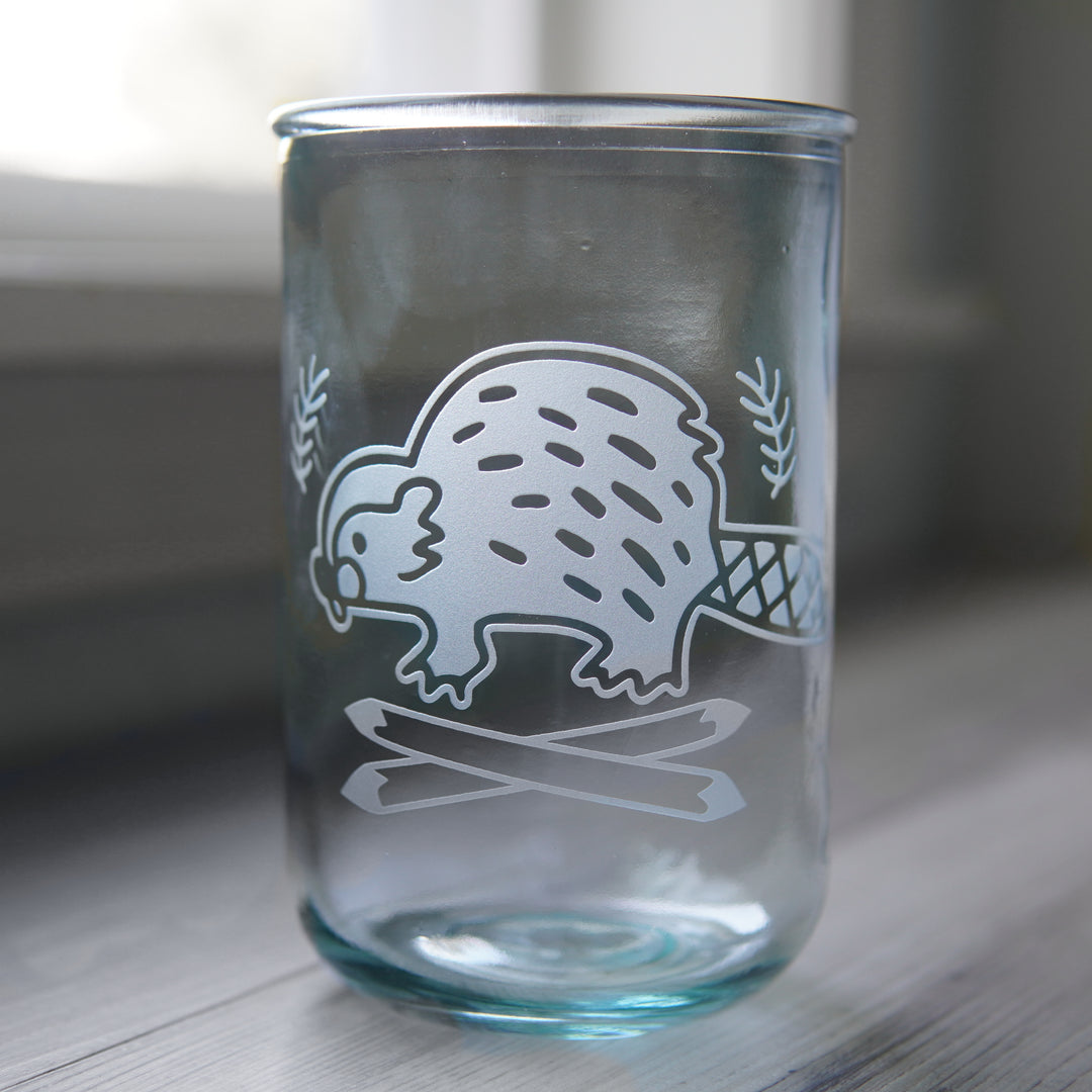 Tall recycled glass cup engraved with a cute beaver and crossed logs