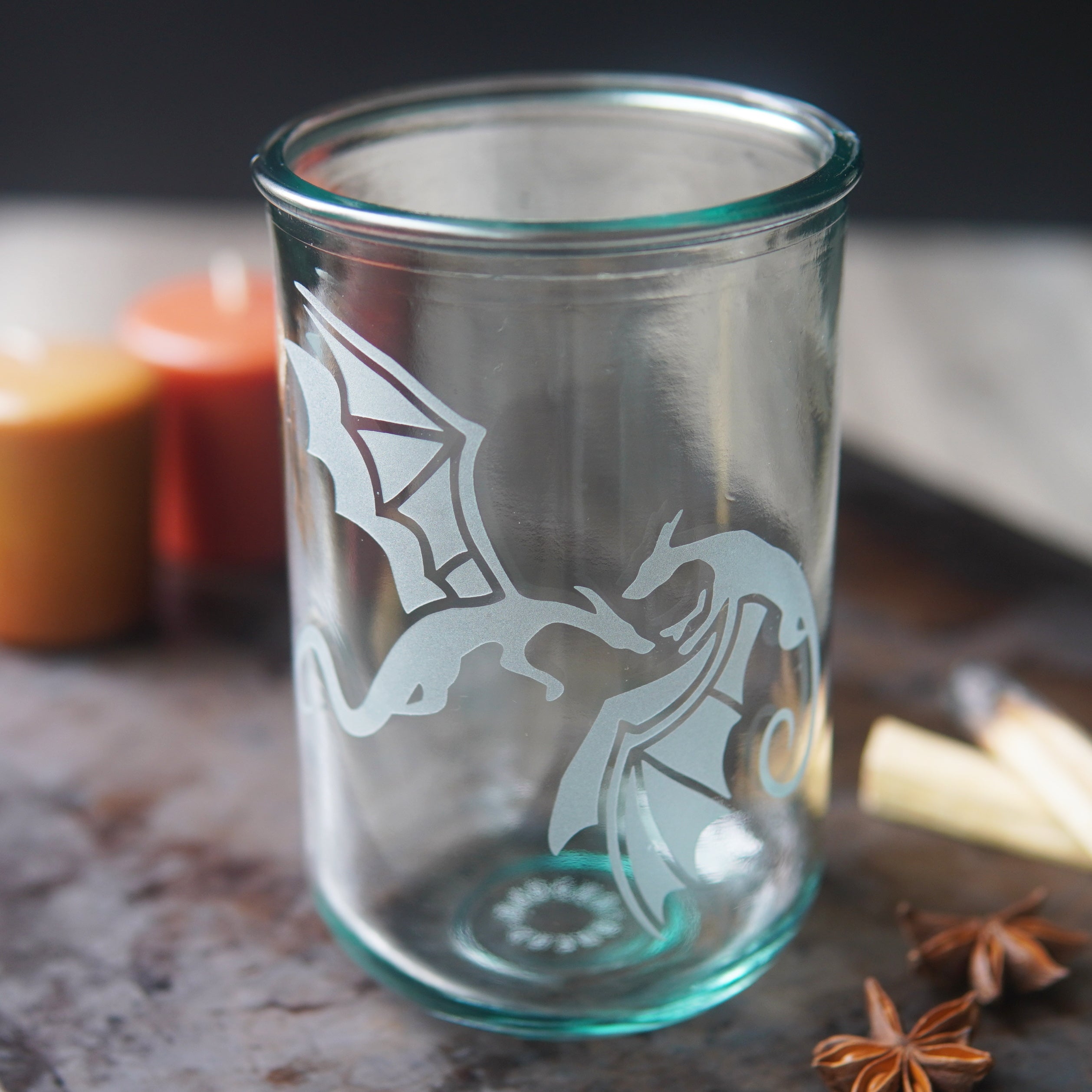 winged dragons engraved on a tall glass