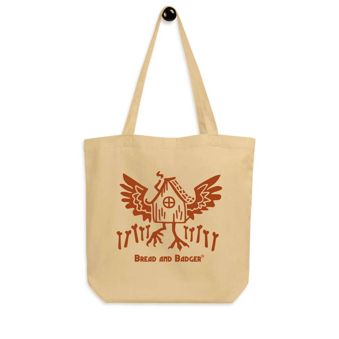 Beige tote bag with red Baba Yaga's hut graphic and 'Bread and Badger' text on a white background