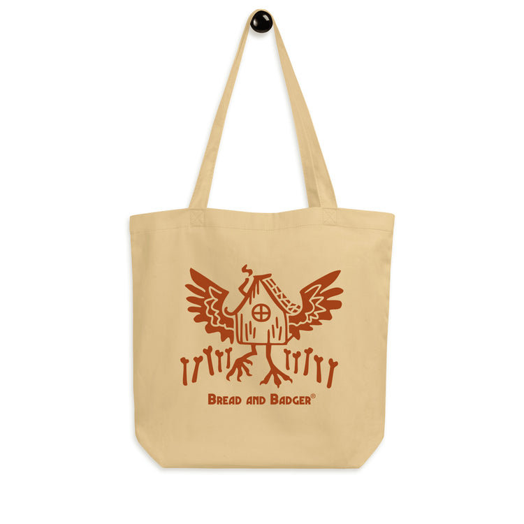 Beige tote bag with red Baba Yaga's hut graphic and 'Bread and Badger' text on a white background