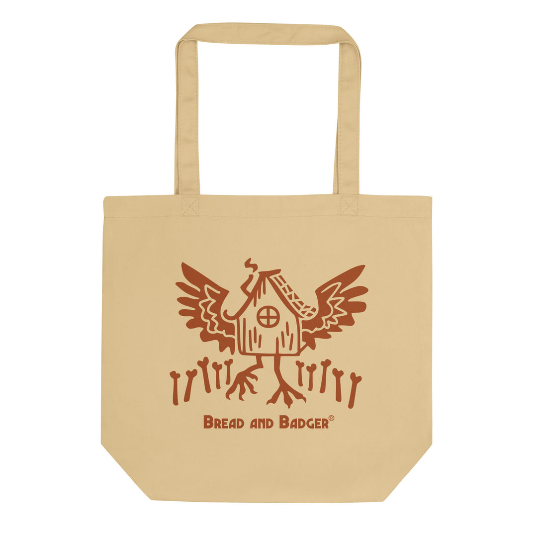 Beige tote bag with a Baba Yaga's hut graphic  and 'Bread and Badger' logo on a white background