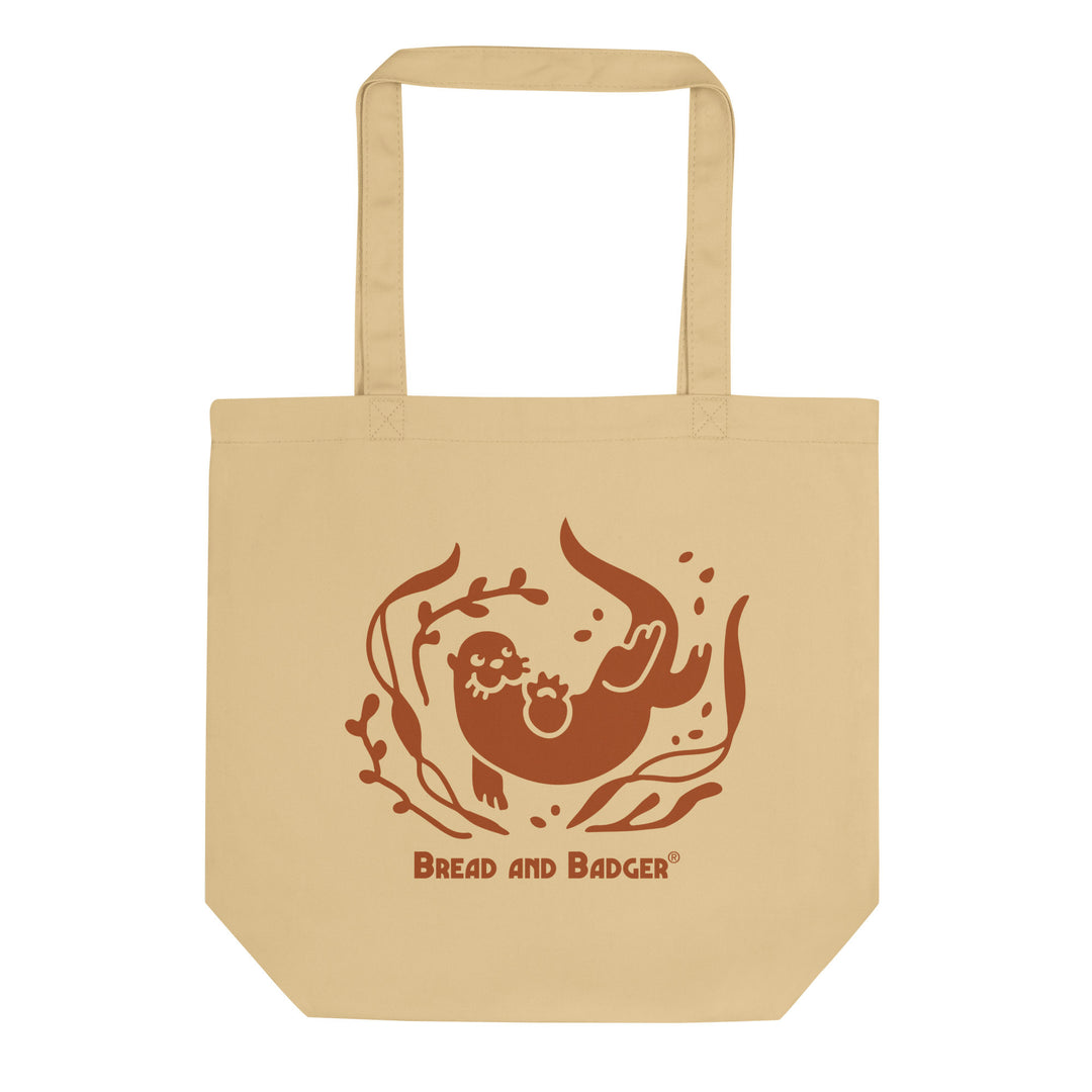 beige tote bag with a brown otter and 'Bread and Badger' text on a white background