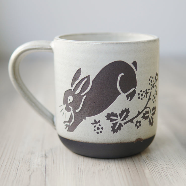 white glazed rabbit mug in dark brown clay
