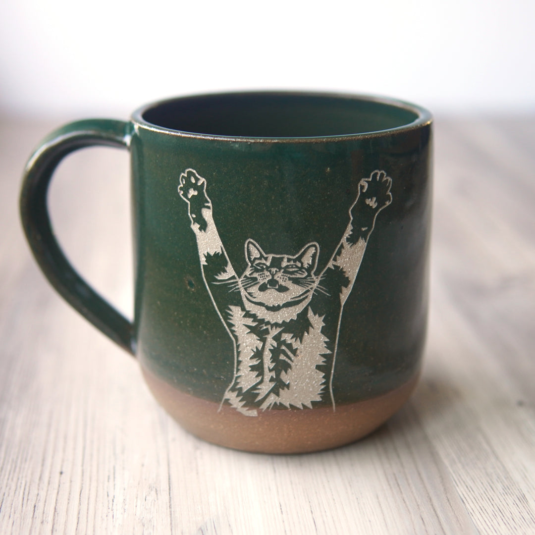 pine green stretching cat mug