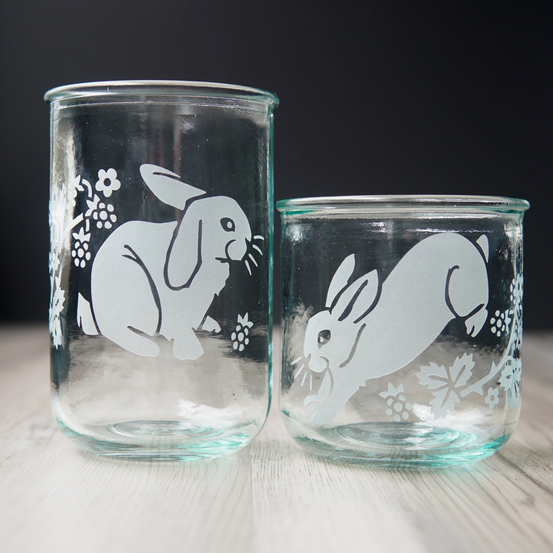 lop-eared and leaping rabbits with blackberry branches etched onto tall and short glassware