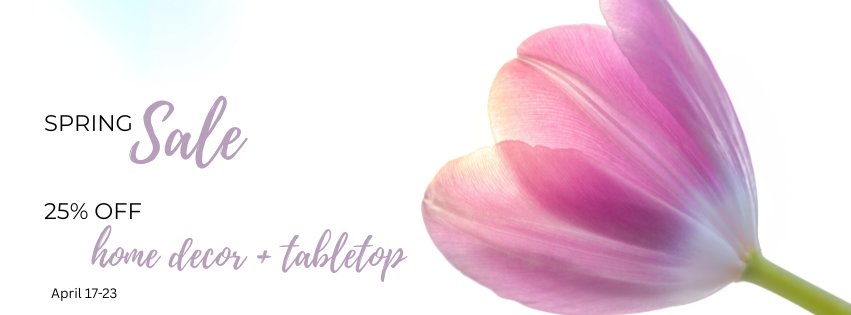 Pink tulip with spring sale text on a white background. Text reads, "Spring Sale. 25% off home decor and tabletop April 17 through 23"