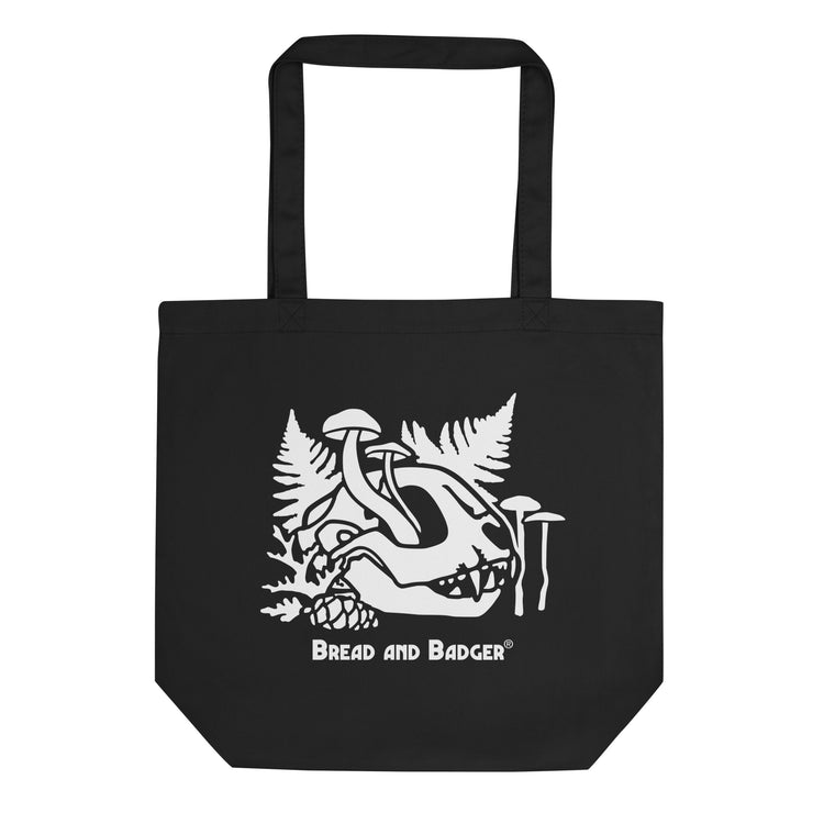 Black tote bag with white cat skull graphic design and 'Bread and Badger' text on a white background
