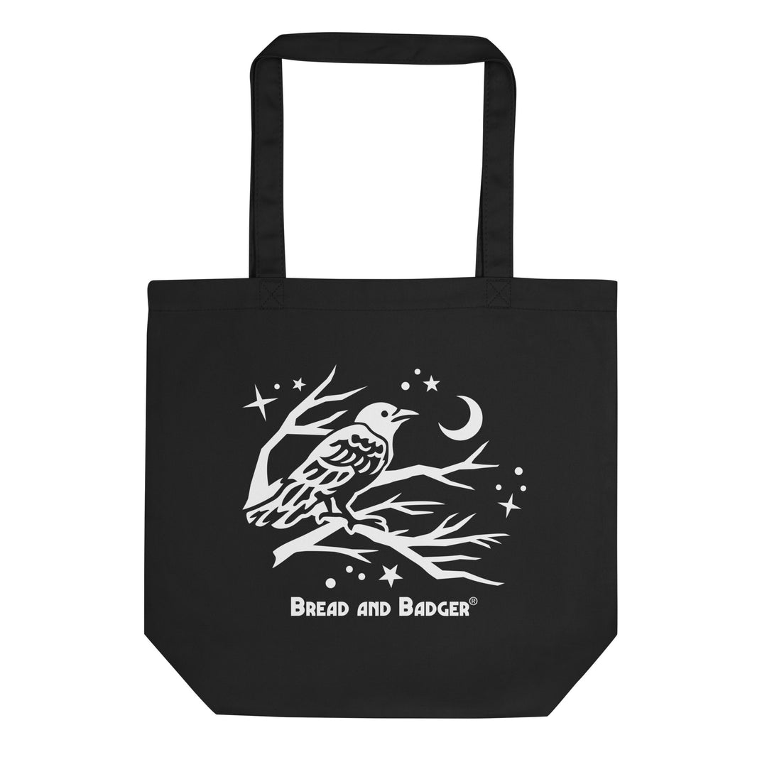 Black tote bag with a white bird design and 'Bread and Badger' logo on a white background