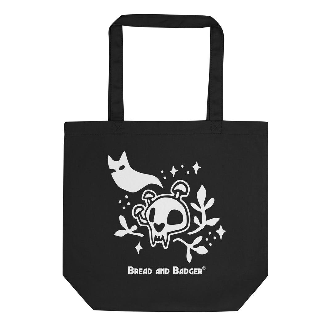 Black tote bag with white skull and cat ghost design and 'Bread and Badger' logo.