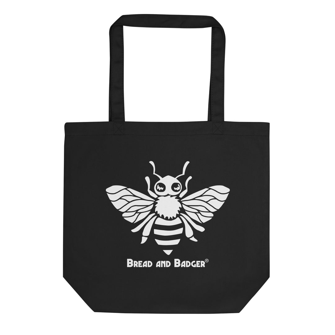 Black tote bag with a white bee design and 'Bread and Badger' text on a white background